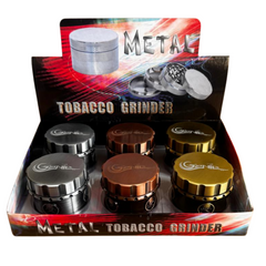 Box of 6 Genie Metal Tobacco Grinders – Magnetic, Skull & Leaf Embossed, Copper Silver Gold