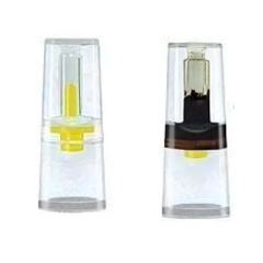 Nic-Out cigarette filter showing before and after use. The filter is clean before use and darkened after use, demonstrating tar and nicotine reduction.