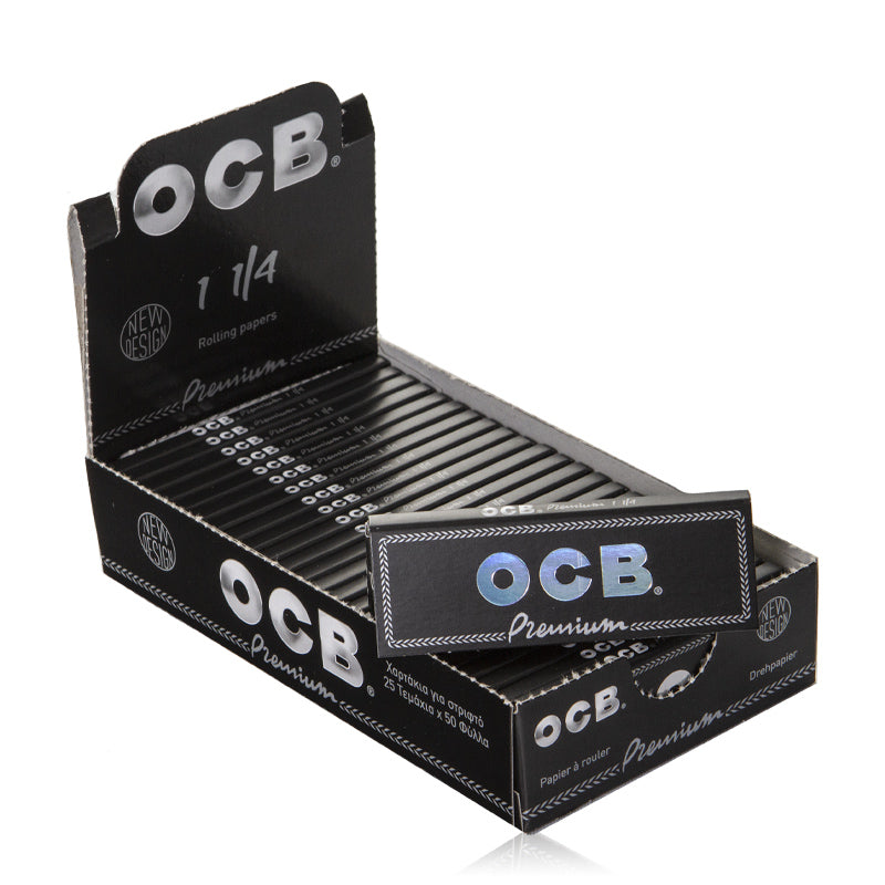 OCB Premium Black Rolling Papers 1¼ – Open display box with 25 neatly arranged packs and one loose pack in front