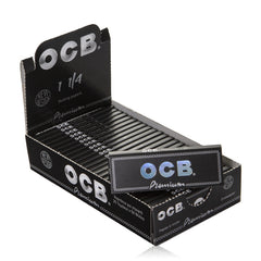 OCB Premium Black Rolling Papers 1¼ – Open display box with 25 neatly arranged packs and one loose pack in front