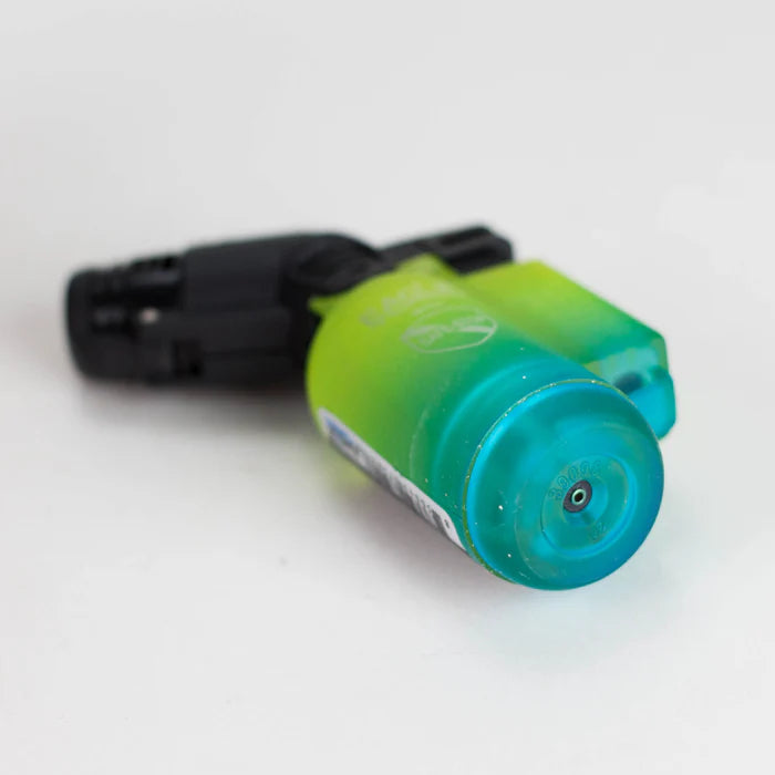 Eagle Torch PT116G Yellow/Blue lighter lying flat with back side facing up, showing refill valve and base design.