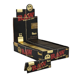 RAW Black Classic 1¼ Rolling Papers – Open Display Box Showing 24 Packs of 50 Ultra-Thin Leaves Each with One Single Pack Highlighted