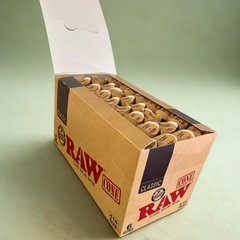 RAW Classic 1¼ Pre-Rolled Cones – Open Display Box Left-Angle, 192 Total Cones, Consistent Burn, Easy Filling.