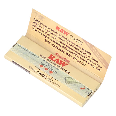 RAW Classic Single Wide Rolling Papers – Full Box of 25 Packs and Open Single Pack Displaying Product Information, Natural Unrefined Vegan Paper