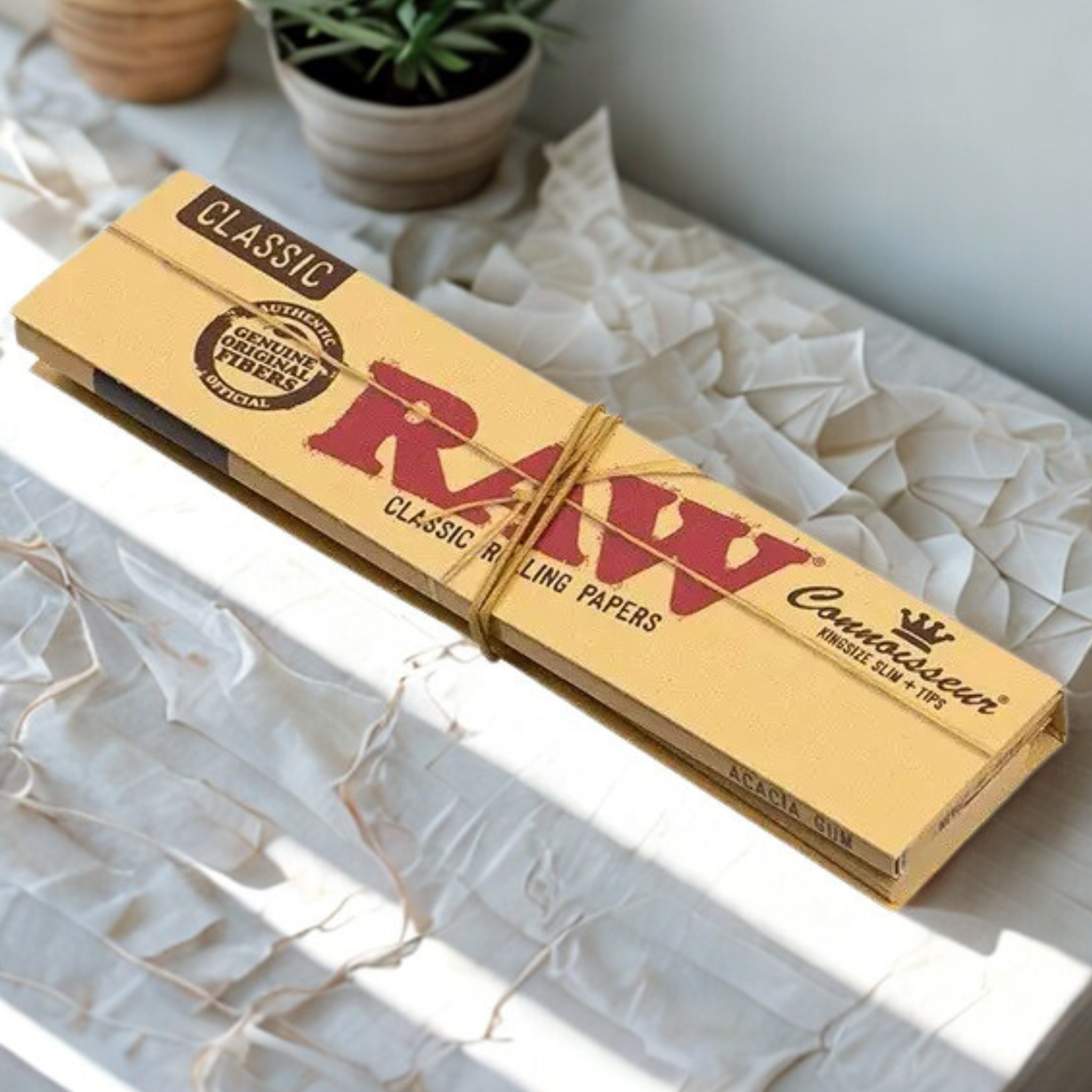 Single sealed pack of RAW Connoisseur Classic King-Size Slim Rolling Papers showing the front packaging.